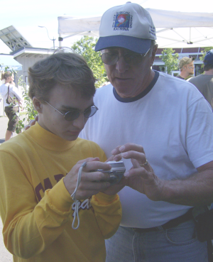 kid and grandpa discussing camera