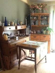 dining table with pretty runner, sideboard and hutch dusted and straightened up