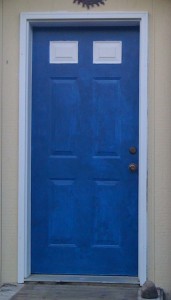 blue door, two white "windows" at the top needs finishing still