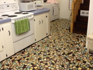 The broken-tile floor of the kitchen in the Filberg house in Comox, B.C.  It shows an economical and whimsical way to introduce movement and color (and the slight variations in depth make the floor more comfortable for standing).