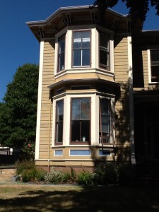 Interesting four-color Italianate house in Victoria.  LOVE the use of blue for accent against the caramel-chocolate-cream base!