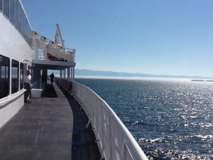 Coming home - the United States seen through a rising fog that enveloped us and kept us in suspense about 20 minute out from Victoria until just after we passed the breakwater at Port Angeles.