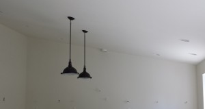 Two pendants for over the island.  The fresnel-style lenses will make the space seem very bright and work-ready!