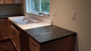 The sink pretty well covers the dishwasher, so this section abuts it slightly and covers the last drawer unit.  Tom and I worked for an hour thinking about how to place the counters so we could show off this lovely inclusion...  and its mate on the island.  So amazing...