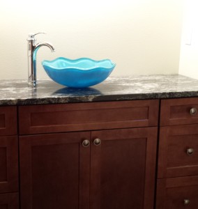 We bought the vessel sink months ago from an online sale site.  The fancy faucet was more money than we had planned on, but worth every penny.   The sink is a little taller than I like, but it is the perfect height for Grant!  And his similarly sized peers...