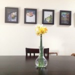 Daffodils on the dining room table, the art-print-calendar we framed.