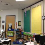 The purple "windsock" was a gift from a student on the second day of school! The empty paper panels on a pulley system! will hold student work and anchor charts.