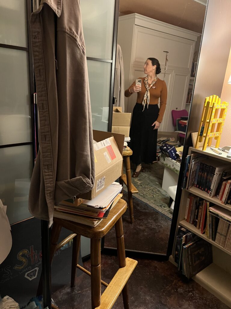 head looking to the left holding cell phone to take image